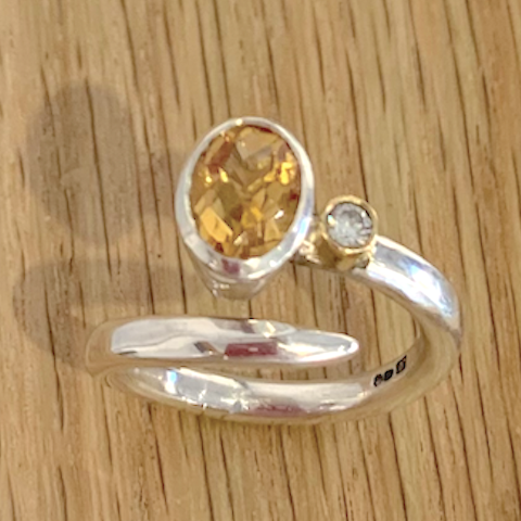 Silver ring forged coil band set with oval citrine and diamond in gold